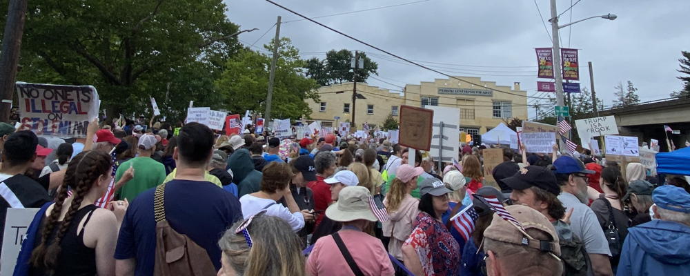 A sea of protestors from the No Kings Rally on June 14, 2025. All you can see is the back of their heads and it is presented just to give a flavor of the size of the crowd. There are hundreds of people in the lot that is holding the rally